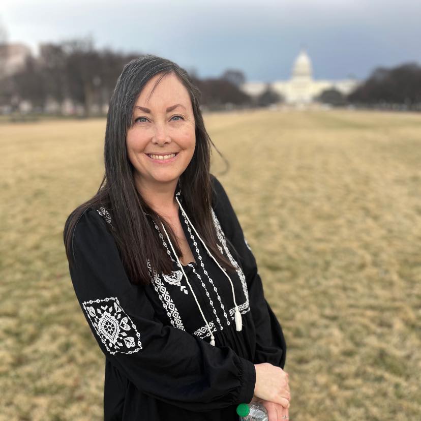 Katie McLain (Katie Johnson) in front of the Capitol Building in Washington D.C.