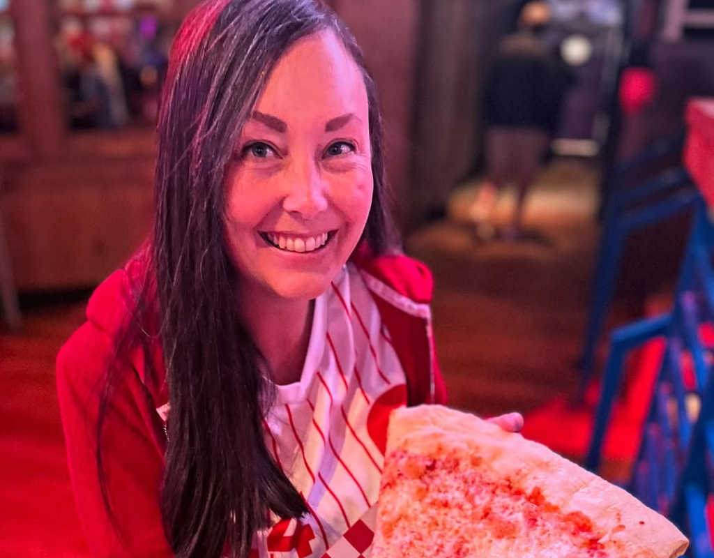 Katie eating Lorenzo's Pizza in Philadelphia, PA.