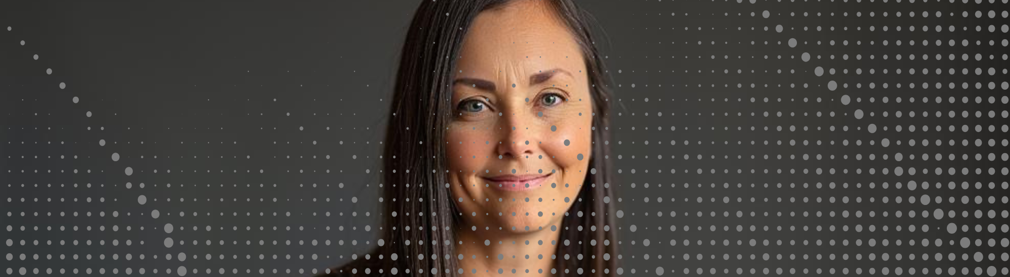 Katie McLain smiling in a professional headshot — experienced educator, storyteller, and advocate for slow living and authentic connection.